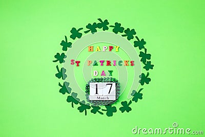 Text happy St. PAtrick`s Day and green clover ornament. Patric`s postcard design. Stock Photo