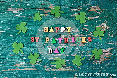 Text happy St. PAtrick`s Day and green clover ornament. Patric`s postcard design. Stock Photo