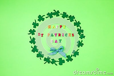 Text happy St. PAtrick`s Day and green clover ornament. Patric`s postcard design. Stock Photo