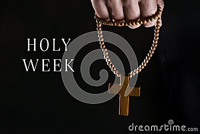 Text Holy Week and man with a rosary Stock Photo