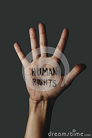 The text human rights in the palm of his hand Stock Photo