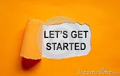 The text `lets get started` appearing behind torn orange paper. Business concept. Copy space Stock Photo
