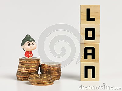 Text LOAN on wooden cubes with stacked coins and miniature old woman. Editorial Stock Photo