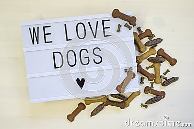 Text We love Dogs written on a lightbox Stock Photo