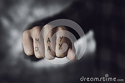 Text may day in the fist of a man Stock Photo