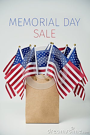 Text memorial day sale and american flags Stock Photo