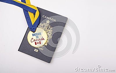 Text of migrate to canada on madel with canadian passport with copy space Stock Photo