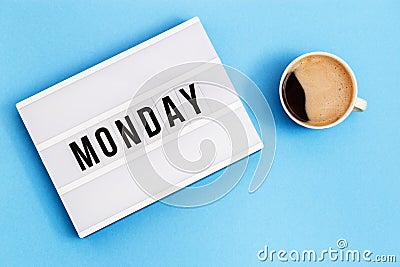 Text monday on lightbox and cup of coffee for holiday - Thank God Its Monday Stock Photo