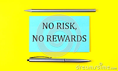 Text NO RISK NO REWARDS on the blue sticker on the yellow background Stock Photo