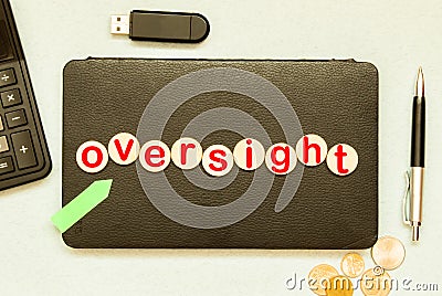 text Oversight on wooden block, business concept Stock Photo