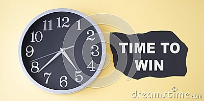 Dark paper. Time to win. Clock near the text. Business concept Stock Photo