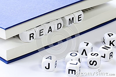 Text reading READ ME between pages of book Stock Photo