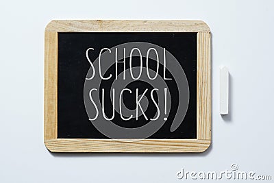 Text school sucks in a blackboard Stock Photo