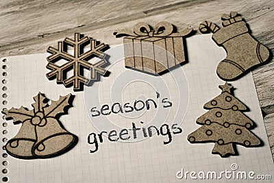 Text seasons greetings and some christmas ornaments Stock Photo