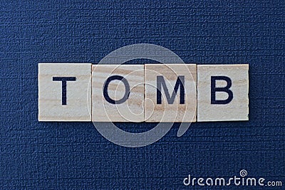 Text from the short word tomb from gray wooden letters Stock Photo