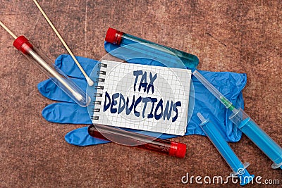 Text showing inspiration Tax Deductions. Business showcase an amount or cost that subtracted from someone s is income Stock Photo