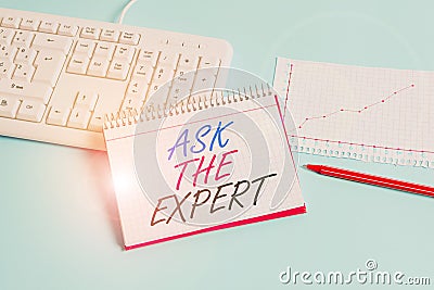 Text sign showing Ask The Expert. Conceptual photo Looking for professional advice Request Help Support Paper blue desk Stock Photo