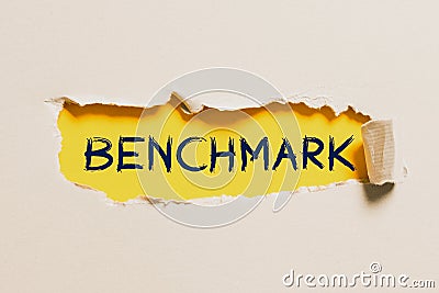 Text sign showing Benchmark. Word for using or able to use two languages especially with equal fluency Typing Hospital Stock Photo