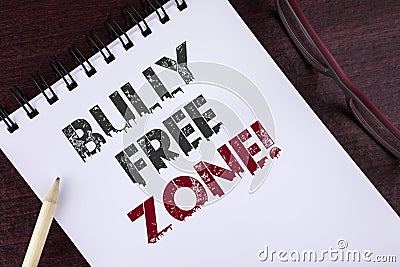 Text sign showing Bully Free Zone Motivational Call. Conceptual photo creating abuse free school college life written on Notepad o Stock Photo