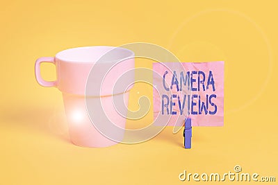 Text sign showing Camera Reviews. Conceptual photo examine or assess formally with the possibility to change Cup empty paper blue Stock Photo