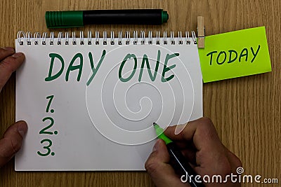 Text sign showing Day One. Conceptual photo Start moment First step Beginning of schedule program event Man holding Stock Photo