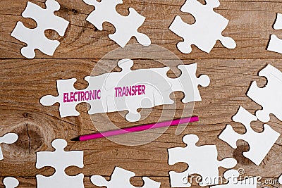 Text sign showing Electronic Transfer. Business idea transaction that takes place over a computerized network Building Stock Photo