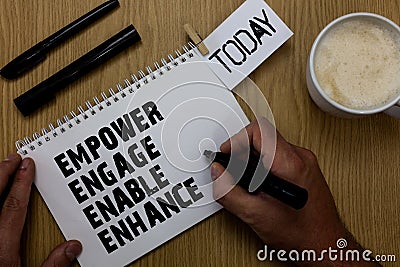 Text sign showing Empower Engage Enable Enhance. Conceptual photo Empowerment Leadership Motivation Engagement Paperclip Stock Photo