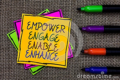 Text sign showing Empower Engage Enable Enhance. Conceptual photo Empowerment Leadership Motivation Engagement Written on some col Stock Photo