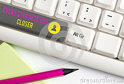 Text sign showing Every Step Gets You Closer. Conceptual photo Keep moving to reach your goals objectives White pc Stock Photo