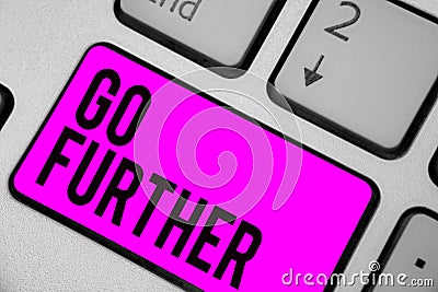 Text sign showing Go Further. Conceptual photo To move to a greater distance or overcome your limitations Keyboard purple key Inte Stock Photo