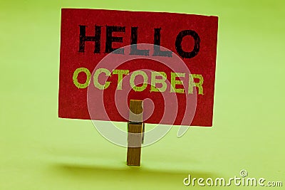 Text sign showing Hello October. Conceptual photo Last Quarter Tenth Month 30days Season Greeting Clothespin holding red Stock Photo