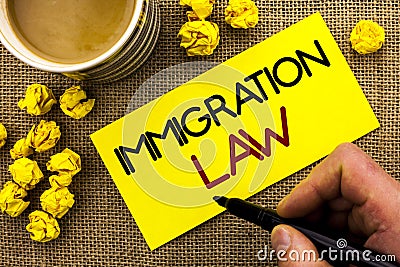 Text sign showing Immigration Law. Conceptual photo National Regulations for immigrants Deportation rules written on Sticky Note P Stock Photo