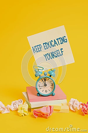 Text sign showing Keep Educating Yourself. Conceptual photo dont stop studying Improve yourself using Courses Alarm Stock Photo