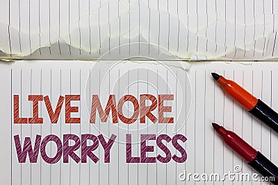 Text sign showing Live More Worry Less. Conceptual photo Have a good attitude motivation be careless enjoy life White torn page wr Stock Photo