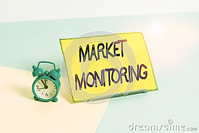 Text sign showing Market Monitoring. Conceptual photo supervising activities in progress in the trading center Mini size alarm Stock Photo