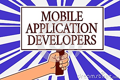 Text sign showing Mobile Application Developers. Conceptual photo create software for devices like Android Man hand holding poster Stock Photo