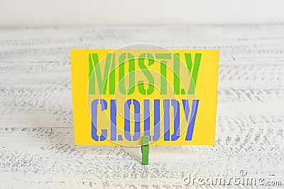 Text sign showing Mostly Cloudy. Conceptual photo Shadowy Vaporous Foggy Fluffy Nebulous Clouds Skyscape Green Stock Photo