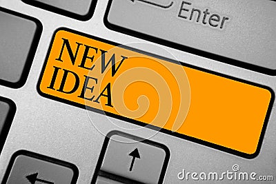 Text sign showing New Idea. Conceptual photo A thought or conception refer to a product of mental activity Keyboard orange key Int Stock Photo