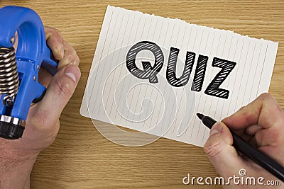 Text sign showing Quiz. Conceptual photo Short Tests Evaluation Examination to quantify your knowledge written by Man on Tear Note Stock Photo