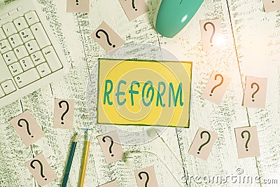 Text sign showing Reform. Conceptual photo to amend or improve by change of forms or removal of faults Writing tools, computer Stock Photo