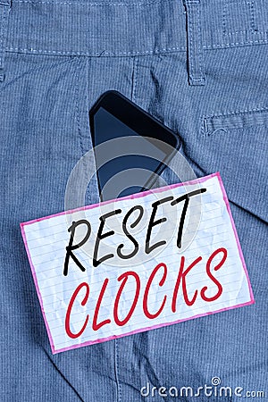 Text sign showing Reset Clocks. Conceptual photo To revisit return to or recreate a time or era from the past Smartphone device Stock Photo
