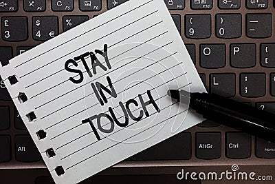 Text sign showing Stay In Touch. Conceptual photo Keep Connected thru Phone Letters Visit Email Social Media Notebook piece paper Stock Photo