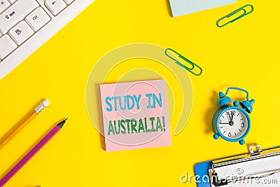Text sign showing Study In Australia. Conceptual photo going into foreign country order complete your studies Flat lay Stock Photo