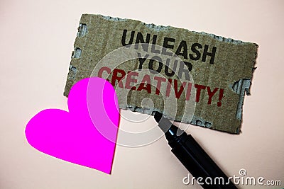 Text sign showing Unleash Your Creativity Call. Conceptual photo Develop Personal Intelligence Wittiness Wisdom Brown paperboard r Stock Photo