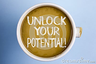 Text sign showing Unlock Your Potential Motivational Call. Conceptual photo Reveal talent Sow Skills Abilities written on Coffee i Stock Photo