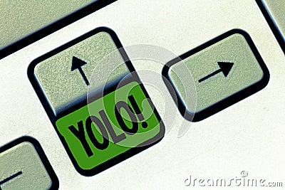 Text sign showing Yolo. Conceptual photo stand for You only live once popular phase among students and teens Stock Photo