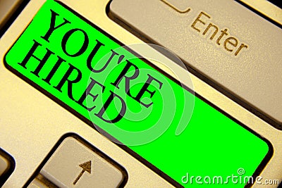 Text sign showing You re are Hired. Conceptual photo New Job Employed Newbie Enlisted Accepted Recruited Keyboard green Stock Photo