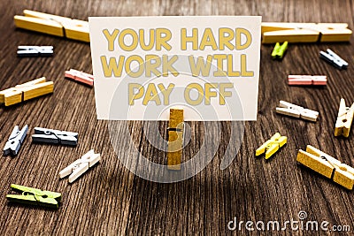 Text sign showing Your Hard Work Will Pay Off. Conceptual photo increasing work effort will lead to great things Clothespin holdin Stock Photo