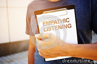Text sign showing hand writing words Empathic Listening Stock Photo