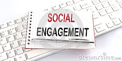 Text SOCIAL ENGAGEMENT on keyboard on the white background Stock Photo